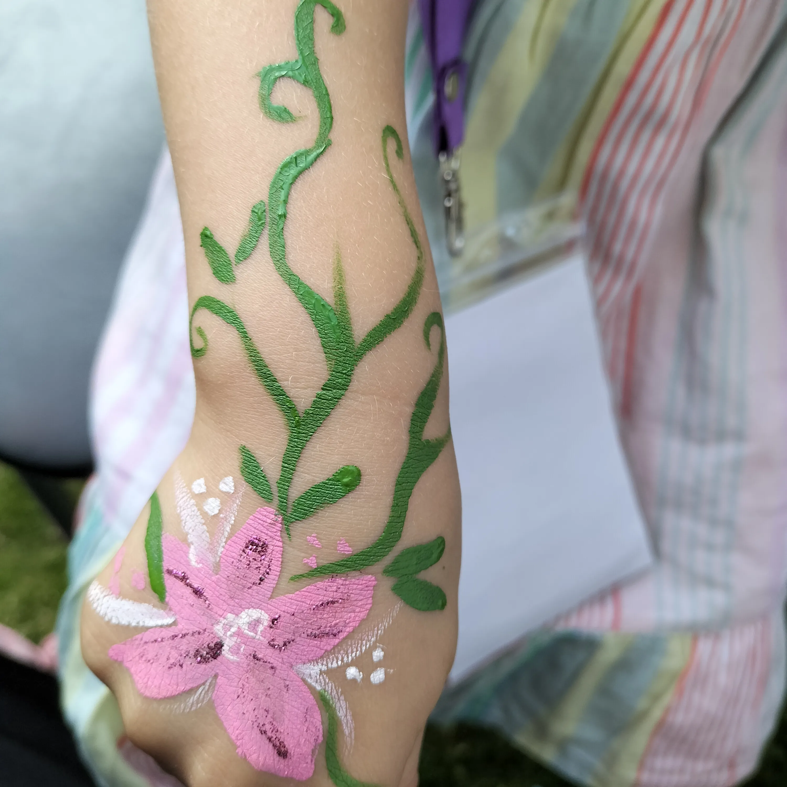 A guest with face paint at one of Anna's events