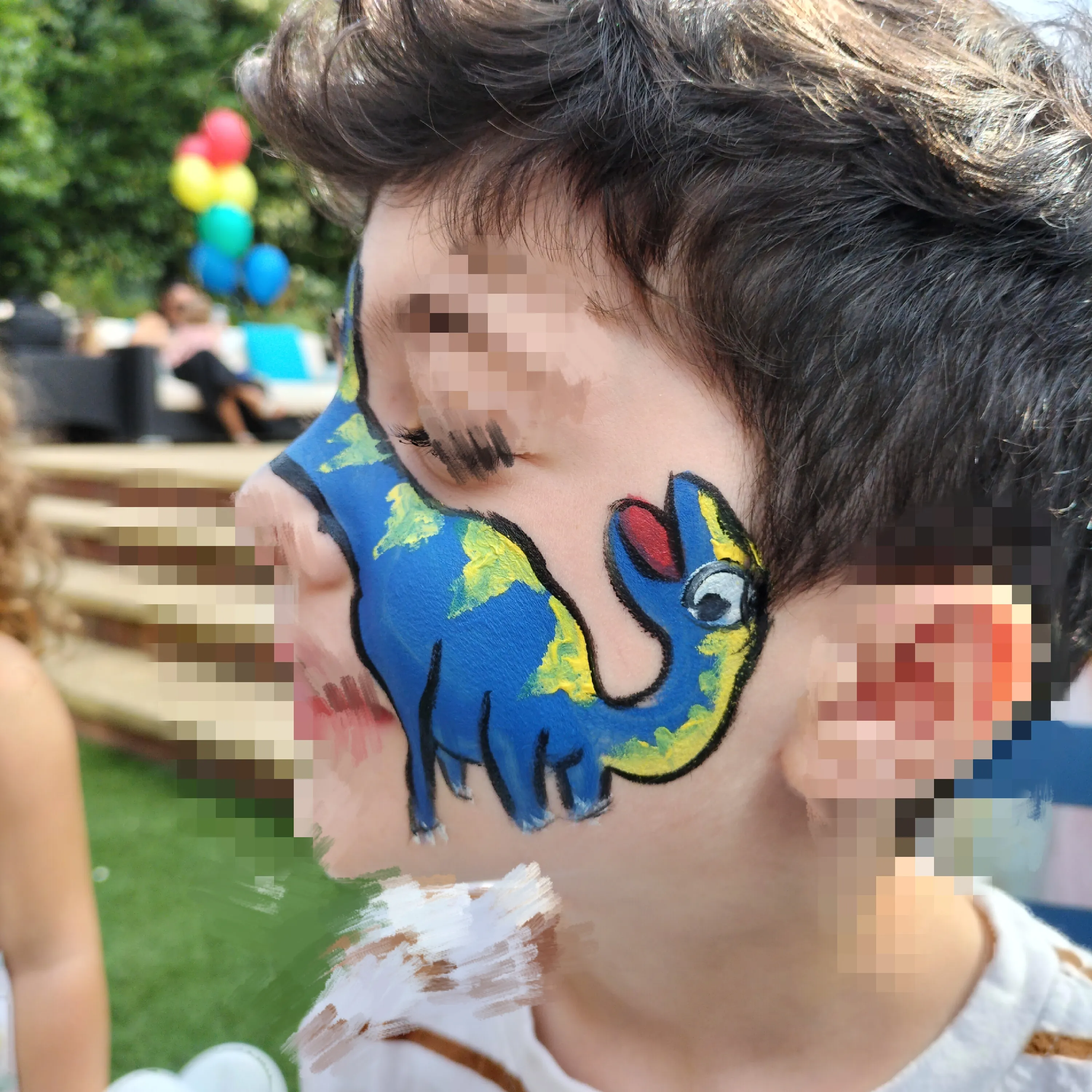 A guest with face paint at one of Anna's events