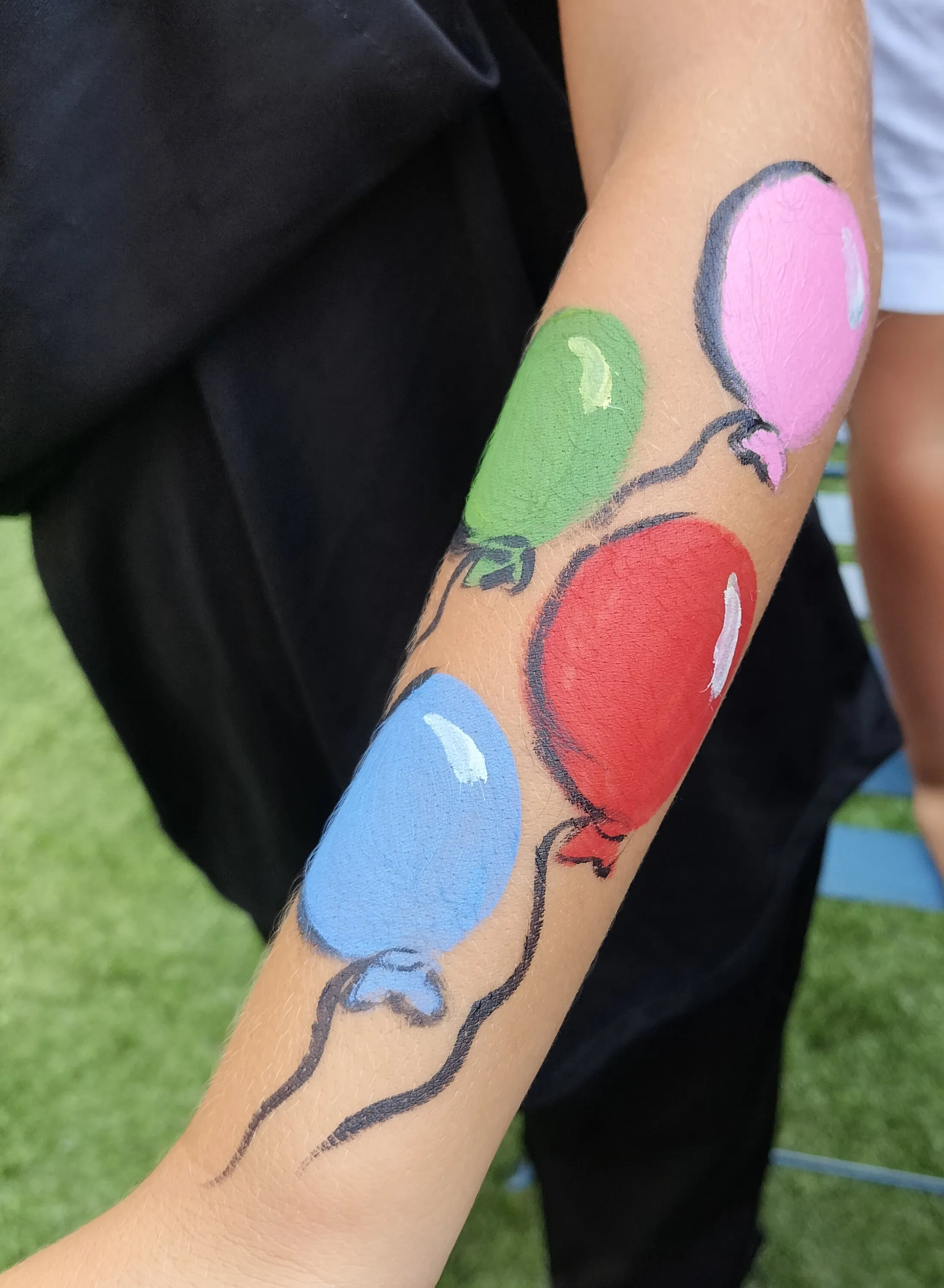 A guest with face paint at one of Anna's events