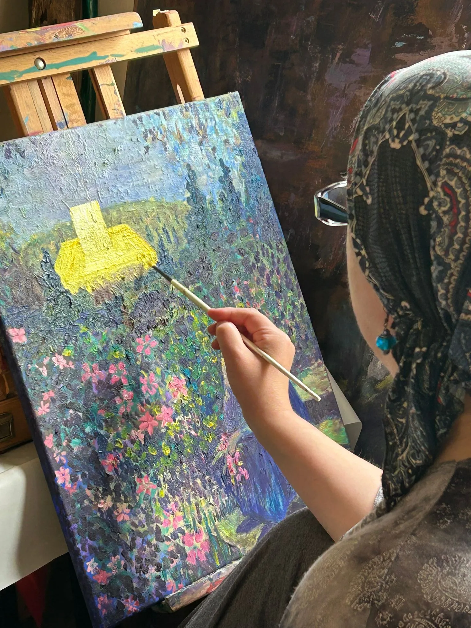 Anna painting in her studio